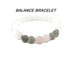 Handmade stretchy intention bracelet with mixed crystals for men and women by GemstoneGO, featuring colorful gemstone beads.