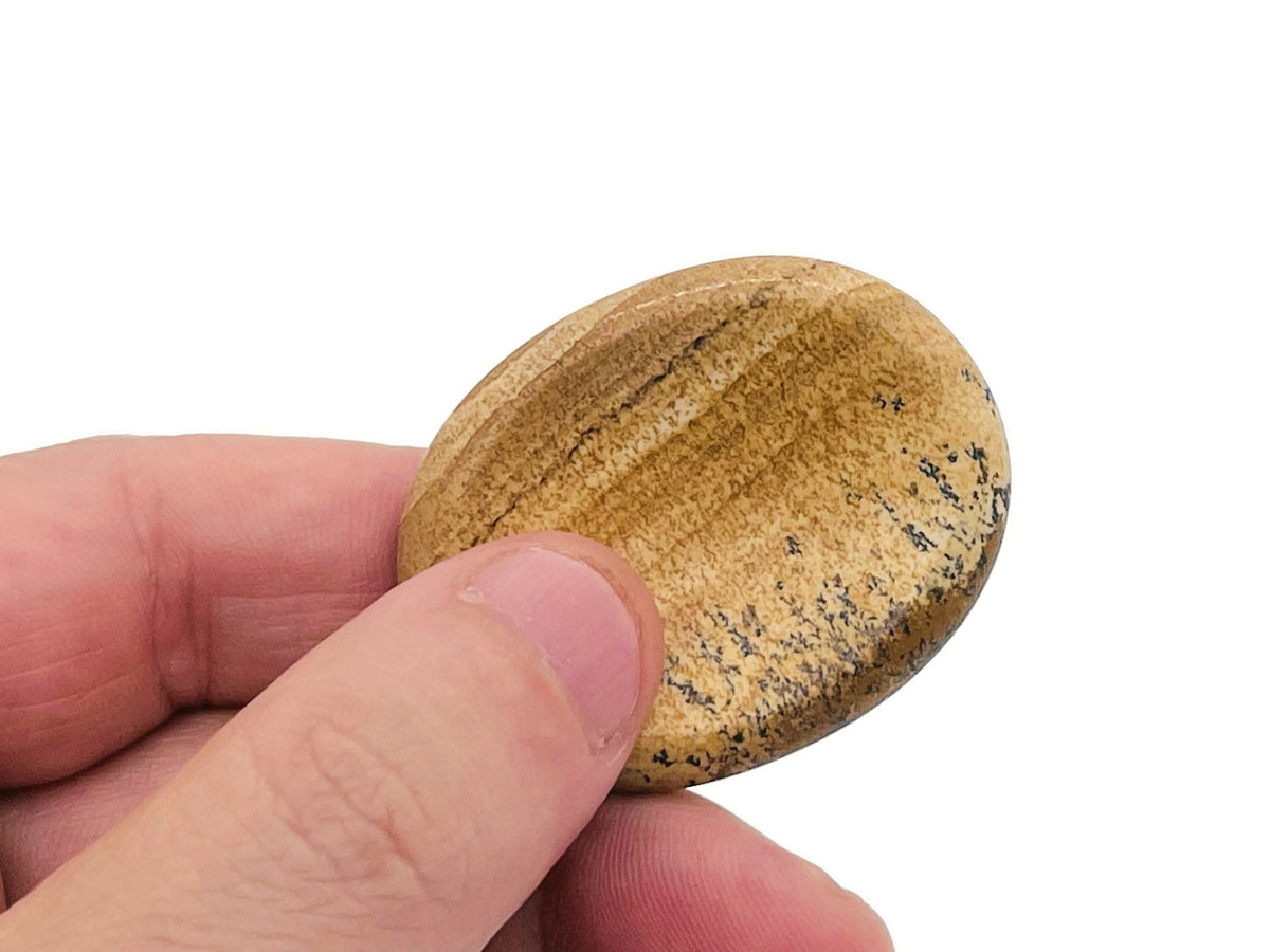 Smooth crystal worry stone from GemstoneGO, measuring 45x35mm, featuring calming colors for stress relief and soothing tactile experience.