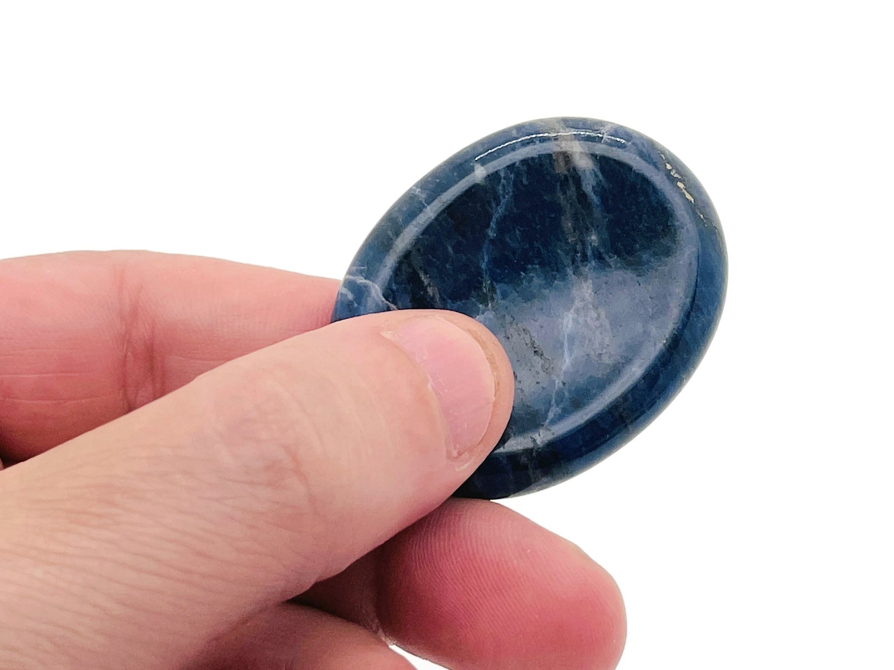 Smooth crystal worry stone from GemstoneGO, measuring 45x35mm, used for stress relief and soothing energy.