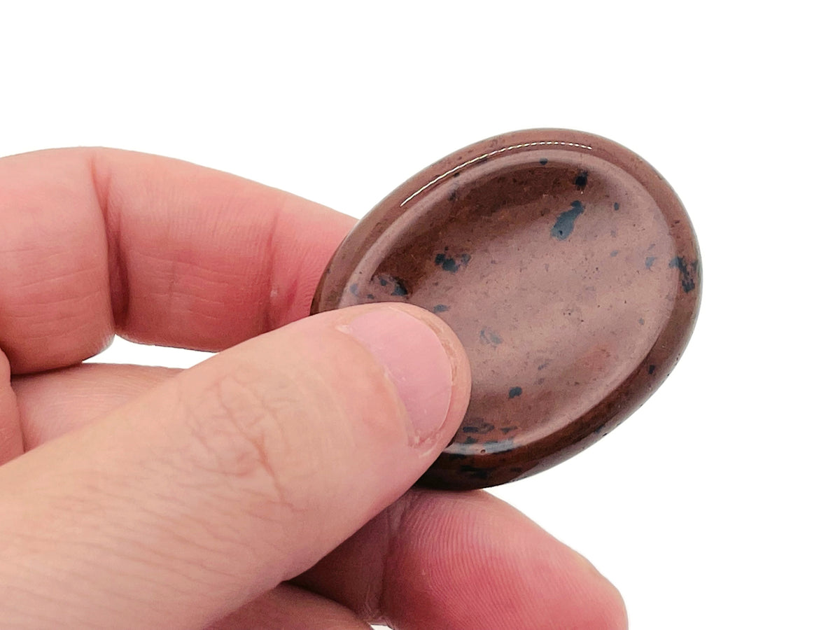 Smooth crystal worry stone from GemstoneGO, 45x35mm, used for stress relief and soothing meditation, with mixed gemstone colors.