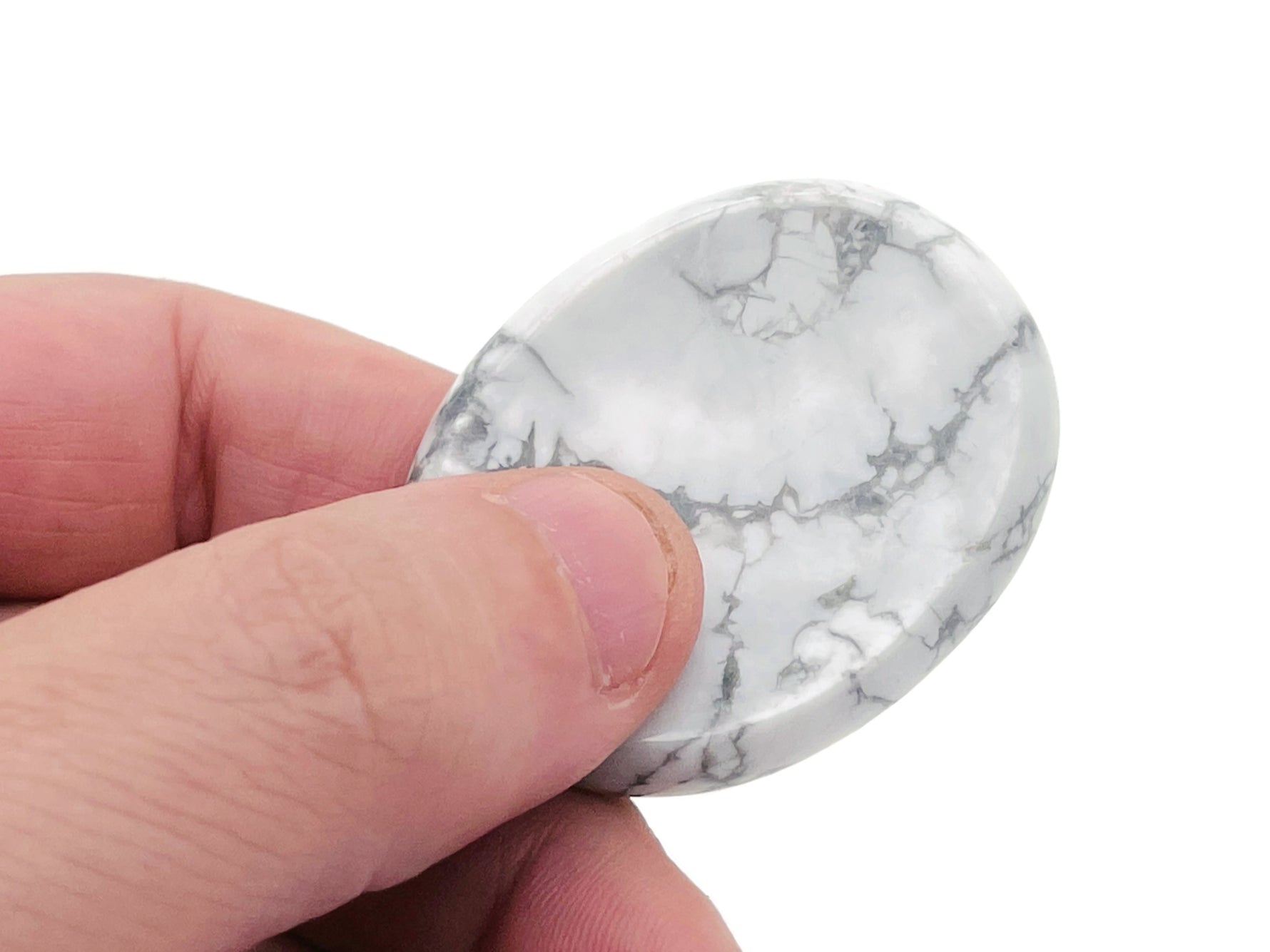 Crystal worry stone from GemstoneGO, 45x35mm soothing crystal for stress relief, with a smooth polished surface in a mixed design.