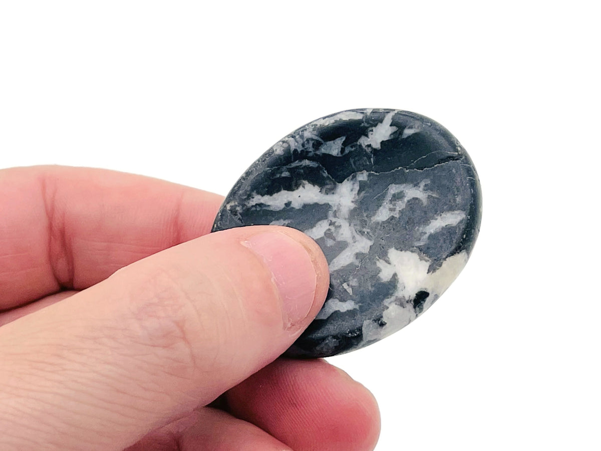Crystal worry stone from GemstoneGO, 45x35mm soothing crystal for stress relief, with mixed gemstone colors and smooth surface.