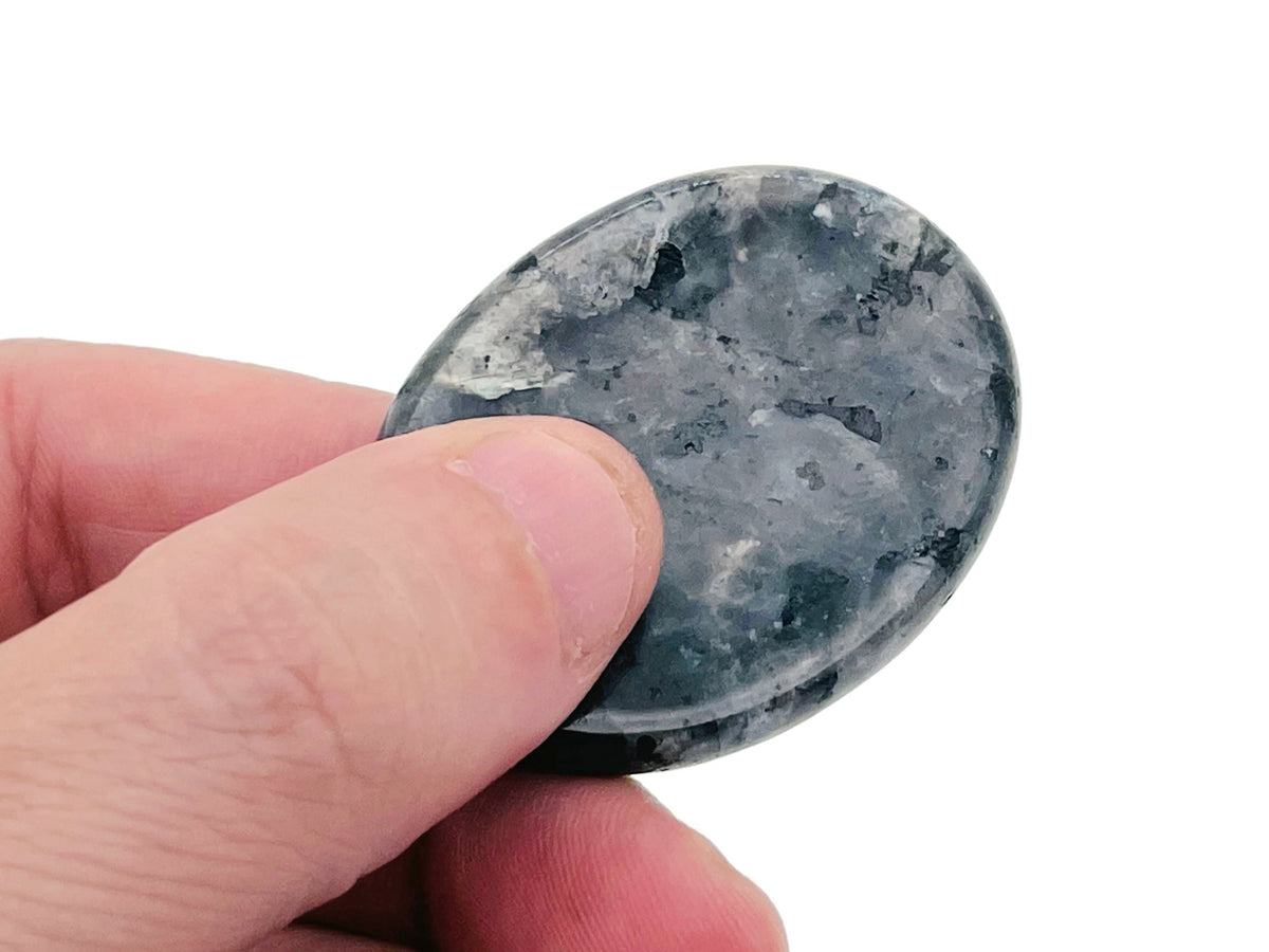 Smooth crystal worry stone from GemstoneGO, measuring 45x35mm, features soothing, colorful gemstone mix for stress relief and relaxation.