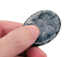 Smooth crystal worry stone from GemstoneGO, measuring 45x35mm, features soothing, colorful gemstone mix for stress relief and relaxation.