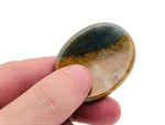 Handheld crystal worry stone from GemstoneGO, 45x35mm soothing stress relief stone with mixed gemstones for calming use.