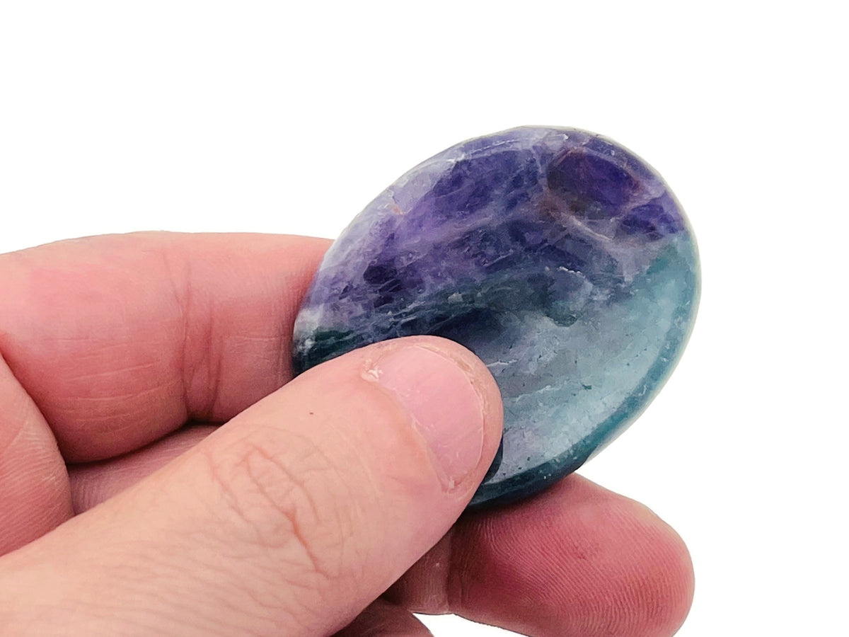 Smooth crystal worry stone from GemstoneGO, 45x35mm, in assorted colors, designed for stress relief and calming touch.