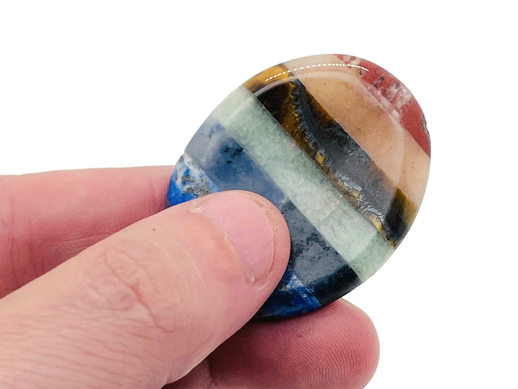 Crystal worry stone from GemstoneGO, 45x35mm soothing crystal for stress relief, with a smooth polished surface and mixed colors.