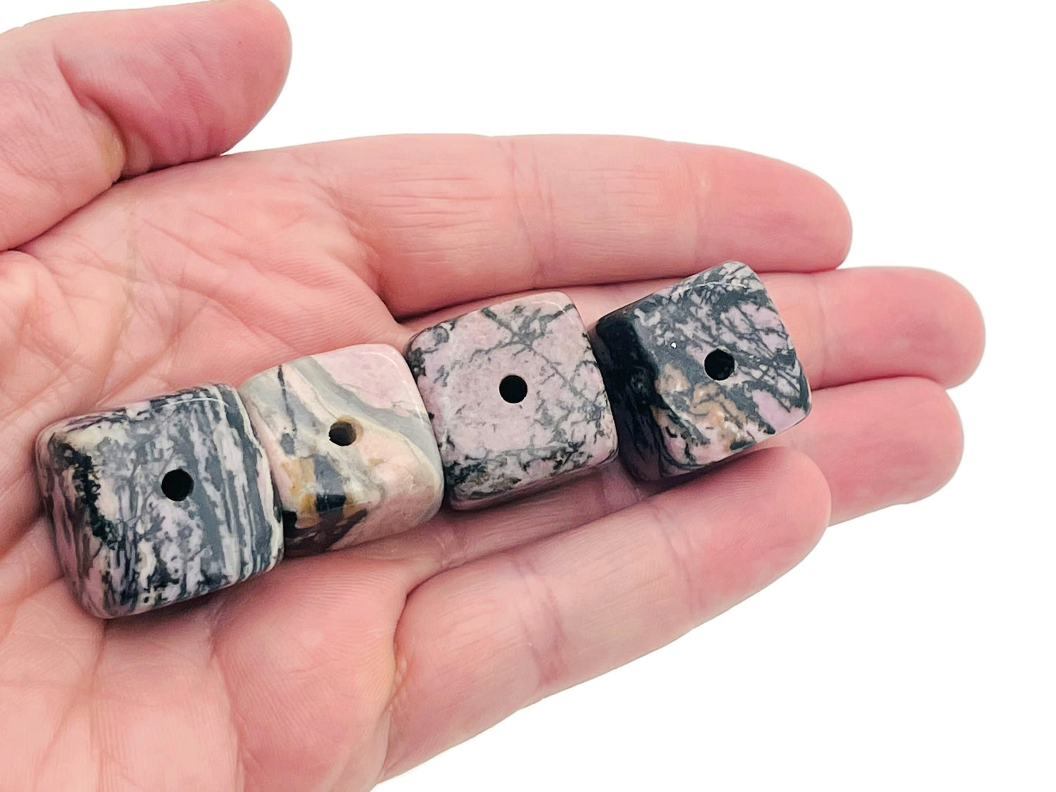 Handmade Rhodonite crystal incense holder with carved design, ideal for holding incense sticks, by GemstoneGO.