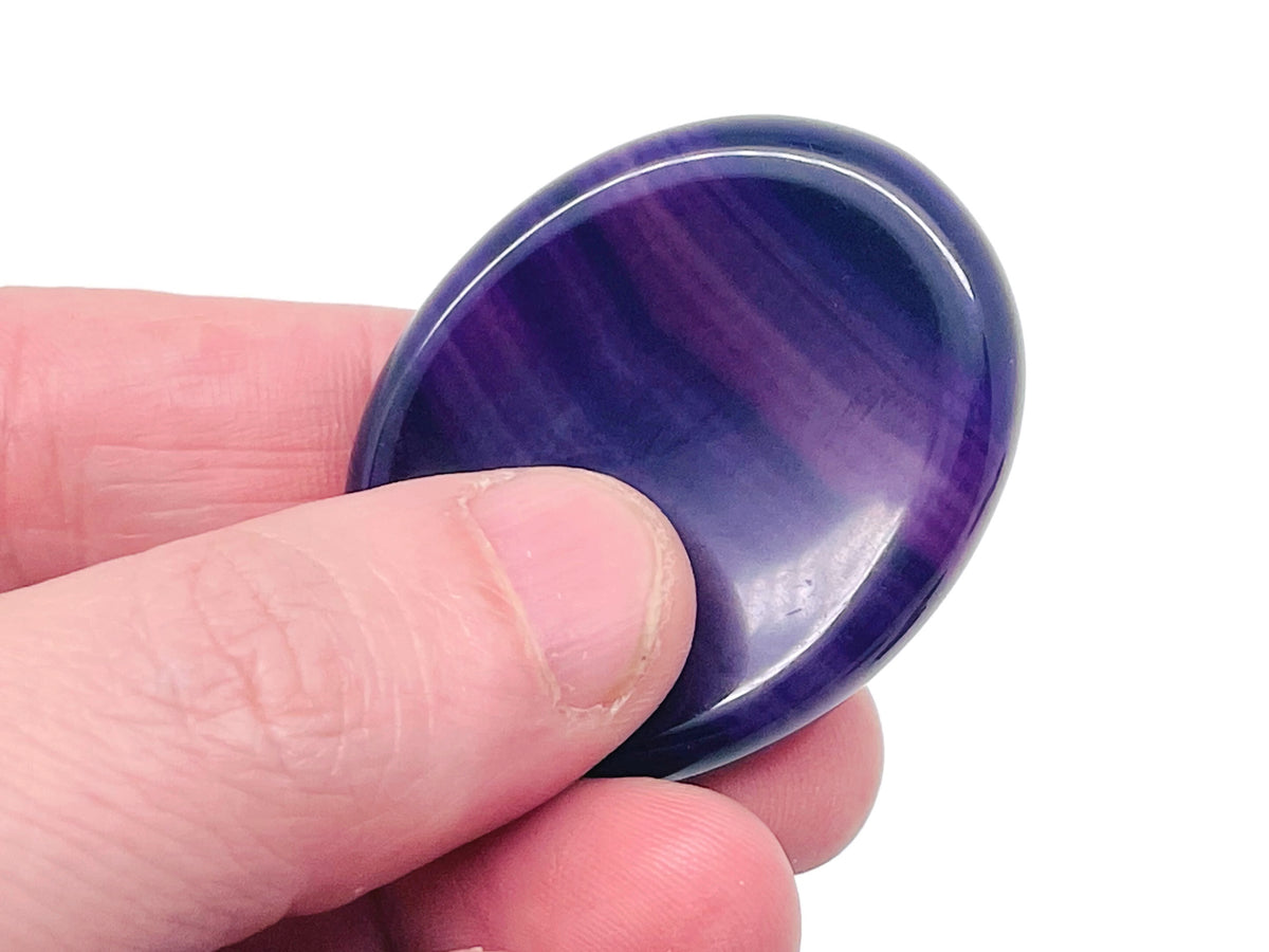 Smooth crystal worry stone from GemstoneGO, 45x35mm, featuring mixed soothing gemstones for stress relief and relaxation.