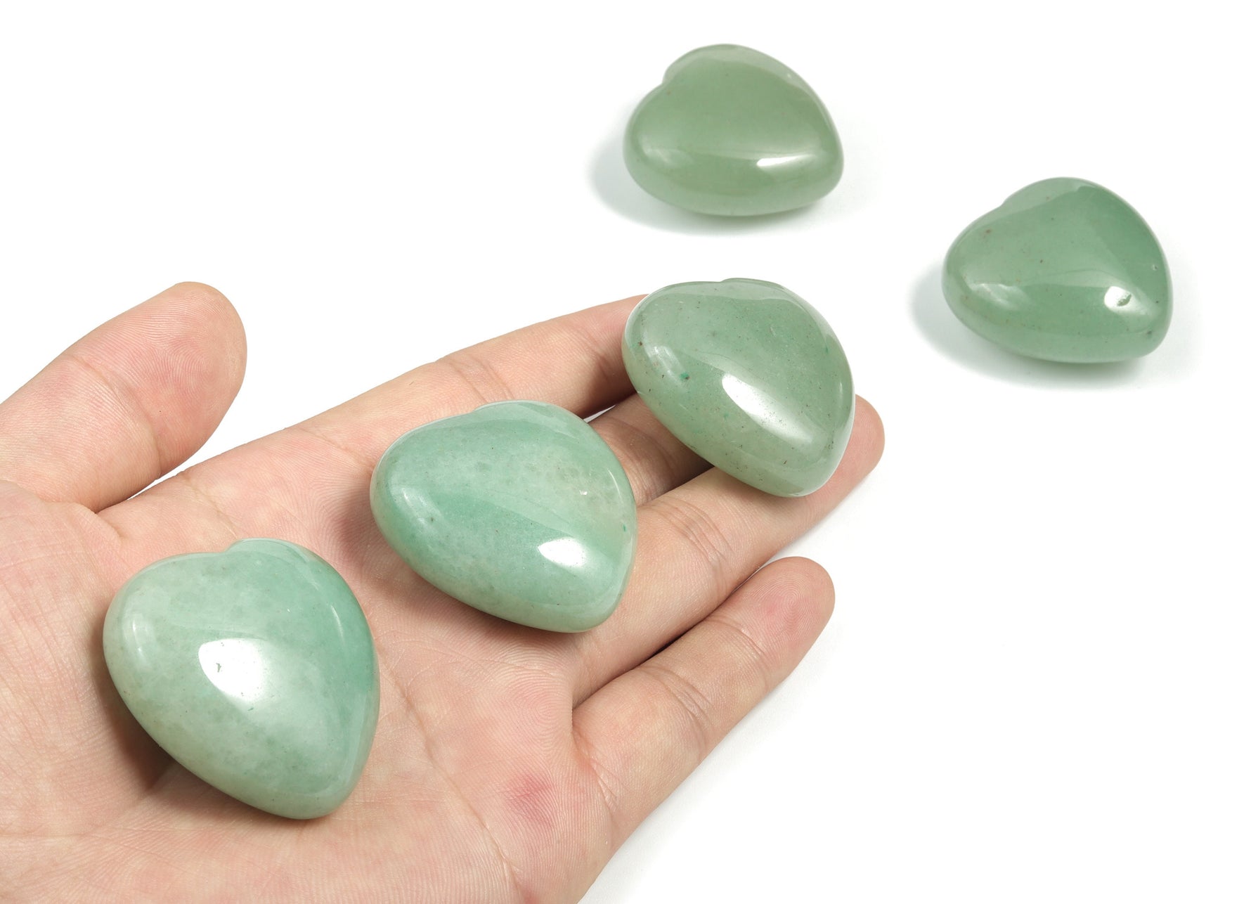 A 40mm aventurine heart-shaped gemstone from GemstoneGO, showcasing its smooth green surface and natural mineral patterns.