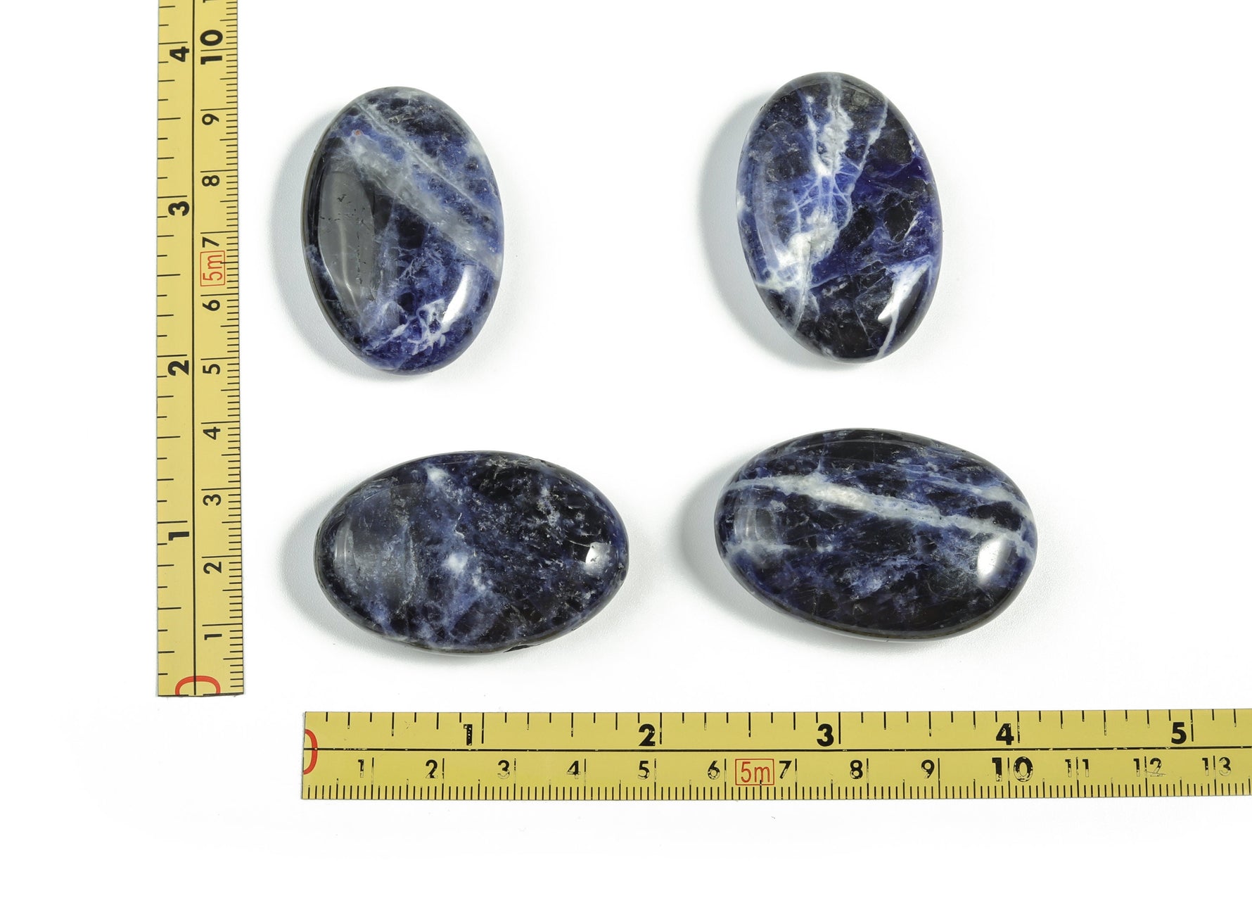Sodalite palm gemstone spa stone, 45x35mm, from GemstoneGO, showcasing deep blue and white mineral patterns.