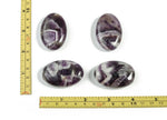 Dream Amethyst palm gemstone spa stone, 45x35mm, from GemstoneGO, showing polished amethyst with smooth surface and purple hues.