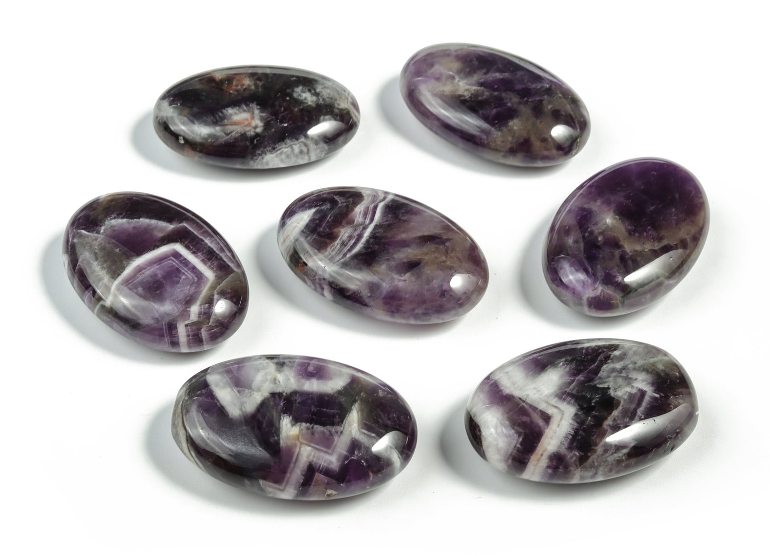Dream Amethyst palm gemstone spa stone, 45x35mm, from GemstoneGO, showing polished purple amethyst with natural gemstone patterns.