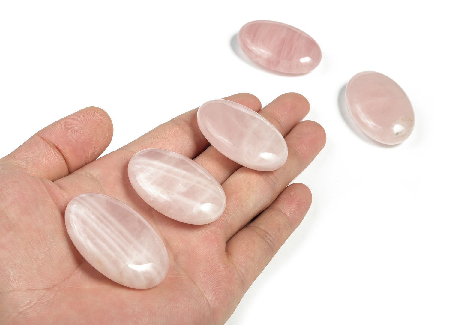 Rose quartz palm gemstone spa stone, 45x35mm, smooth polished healing crystal from GemstoneGO, used for relaxation and energy balancing.