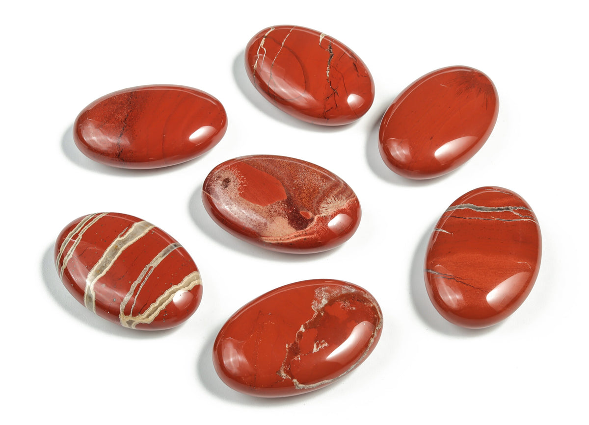 Red Jasper palm gemstone spa stone, 45x35mm, from GemstoneGO, showing polished surface and natural red stone texture.