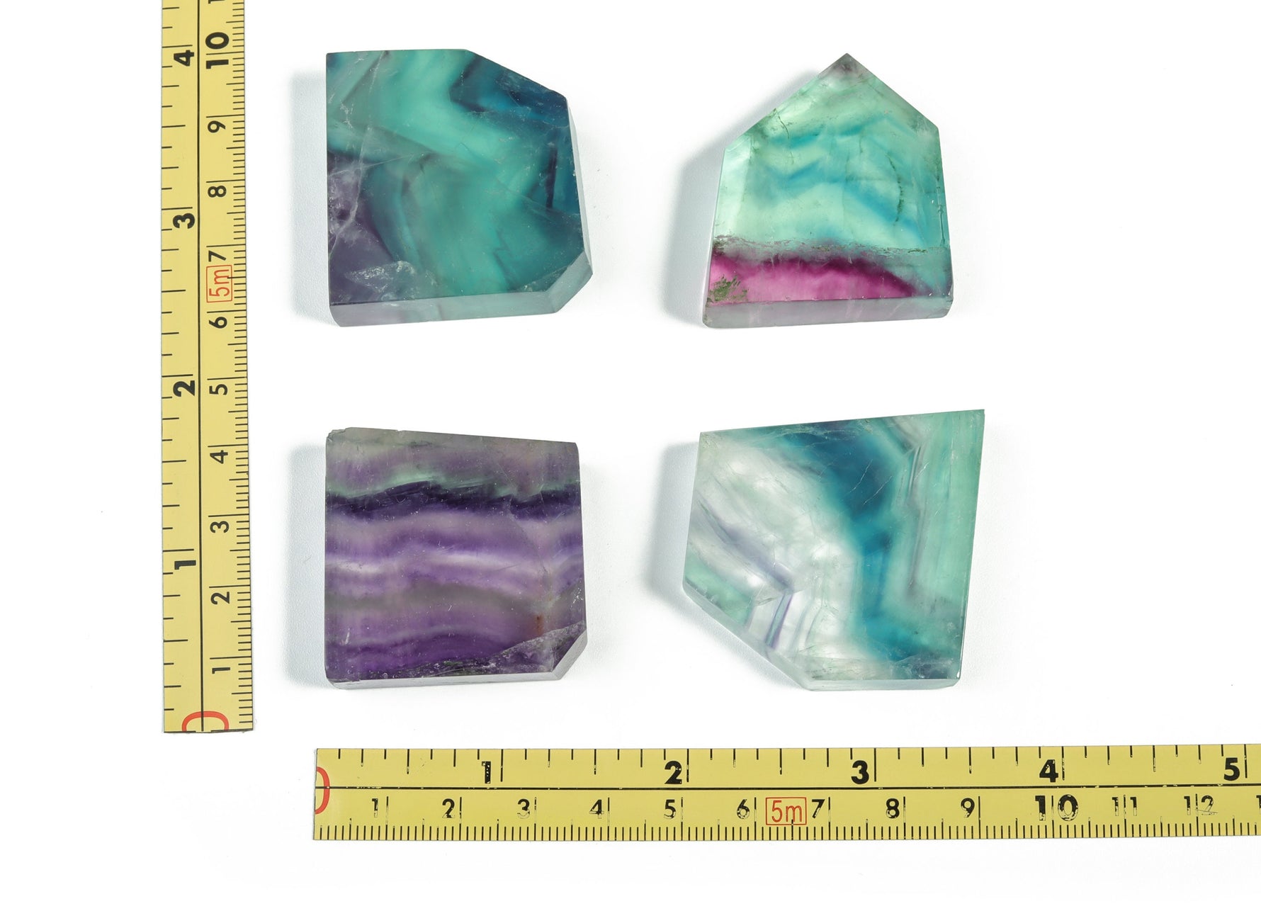 Fluorite flat gemstone slab from GemstoneGO, showcasing vibrant green and purple mineral layers in a polished crystal display.