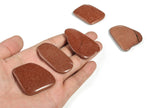 Goldstone flat gemstone slab from GemstoneGO, showcasing a shimmering, smooth crystal crystal with rich golden hues.