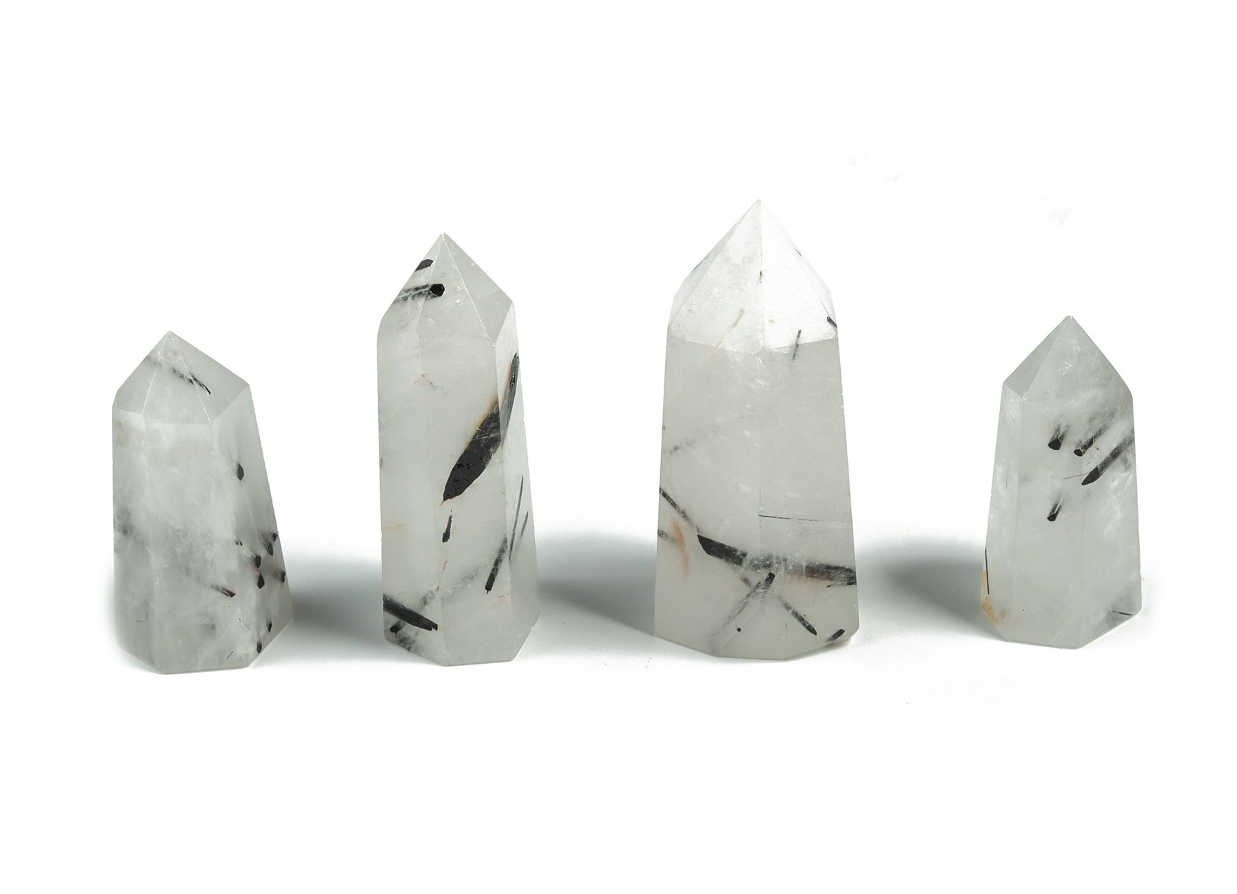 Tourmalinated Quartz obelisk tower crystal from GemstoneGO, featuring black tourmaline inclusions in clear quartz.