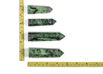 Ruby Zoisite obelisk tower crystal from GemstoneGO, showcasing a vibrant mixed red and green gemstone with smooth polished surfaces.