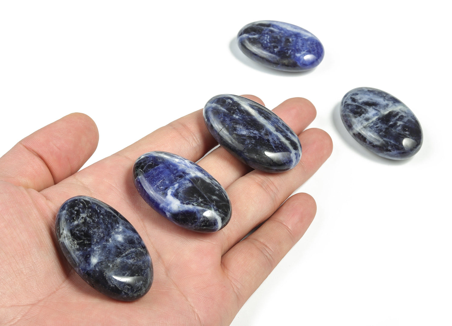 Sodalite palm gemstone spa stone from GemstoneGO, 45x35mm, featuring deep blue and white mineral patterns for relaxation and meditation.