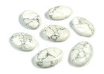 Howlite palm gemstone spa stone, 45x35mm, smooth polished surface, natural white and gray veining, ideal for relaxation and meditation.