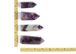 Dream Amethyst obelisk tower crystal from GemstoneGO, featuring a polished purple amethyst stone with natural crystal formations.
