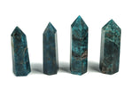 Blue Apatite Quartz obelisk tower crystal with natural blue hues and pointed tip, showcasing smooth polished surface and intricate mineral details.
