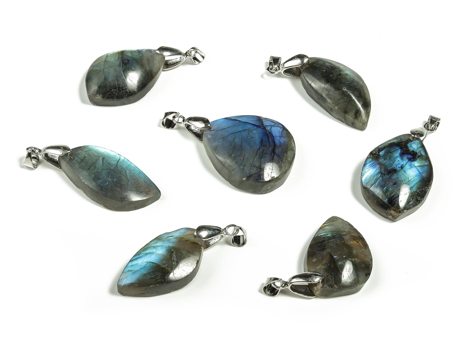 Labradorite crystal pendant from GemstoneGO, showcasing iridescent gemstone with metal bail for jewelry making.