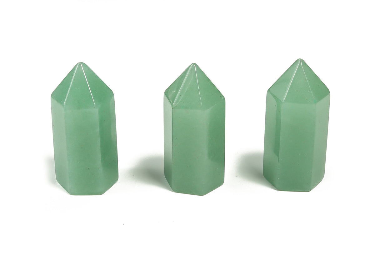 A 35mm green aventurine obelisk tower crystal from GemstoneGO, polished stone with natural stone patterns and smooth surfaces.