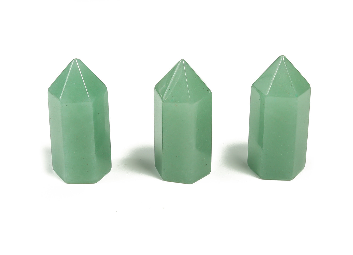 A 35mm green aventurine obelisk tower crystal from GemstoneGO, polished stone with natural stone patterns and smooth surfaces.