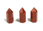 Red Jasper obelisk tower crystal, 35mm, from GemstoneGO, showcasing its deep red color and polished pointed shape.