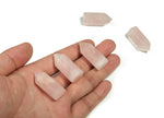 Pink rose quartz obelisk crystal tower from GemstoneGO, polished stone with a pointed top and smooth finish.