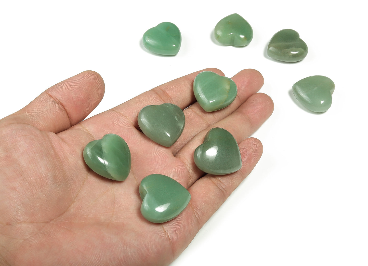 Aventurine heart-shaped gemstone, 25mm, from GemstoneGO, showing its green, sparkly surface and smooth polished finish.
