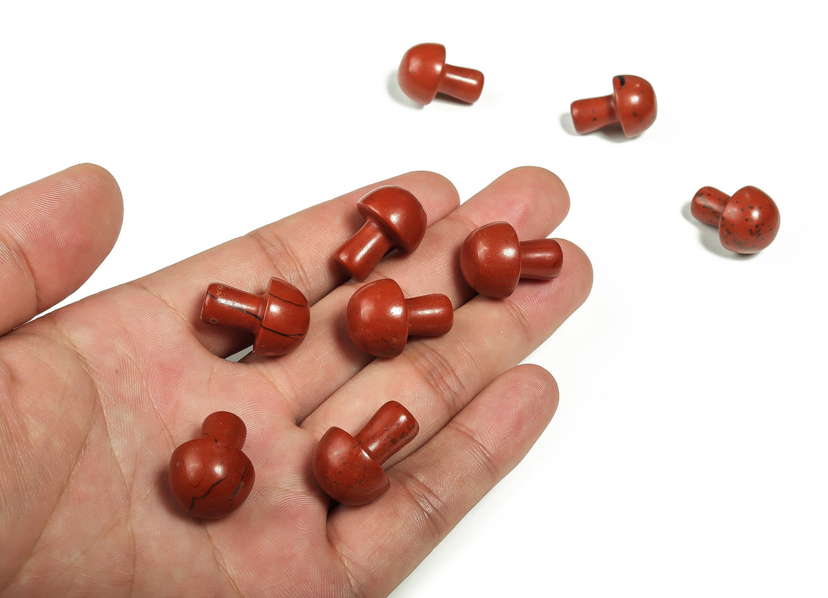 Red Jasper mushroom carved gemstone, 20mm, showing detailed mushroom shape with rich red color and natural stone texture.
