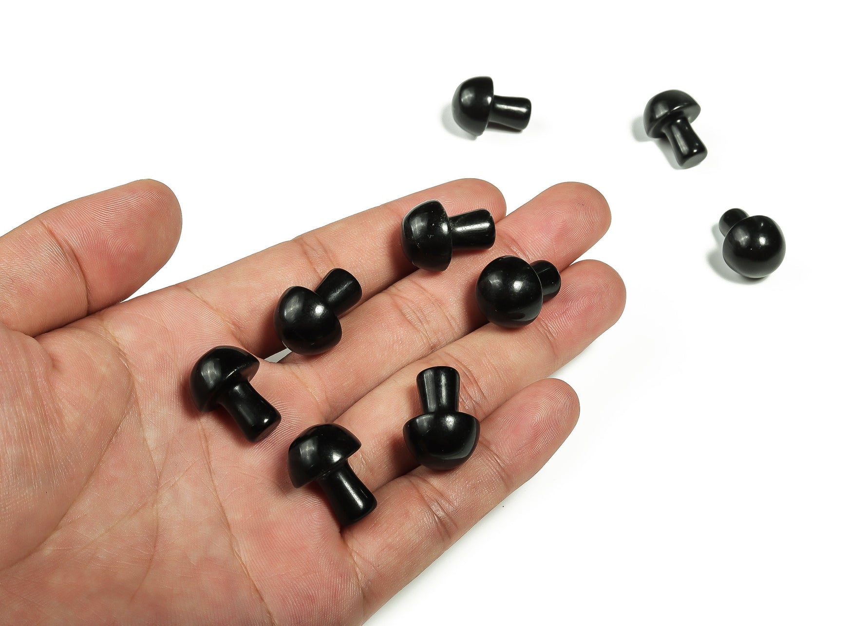 20mm Obsidian mushroom carved gemstone from GemstoneGO, showing detailed black stone with natural carved mushroom shape.