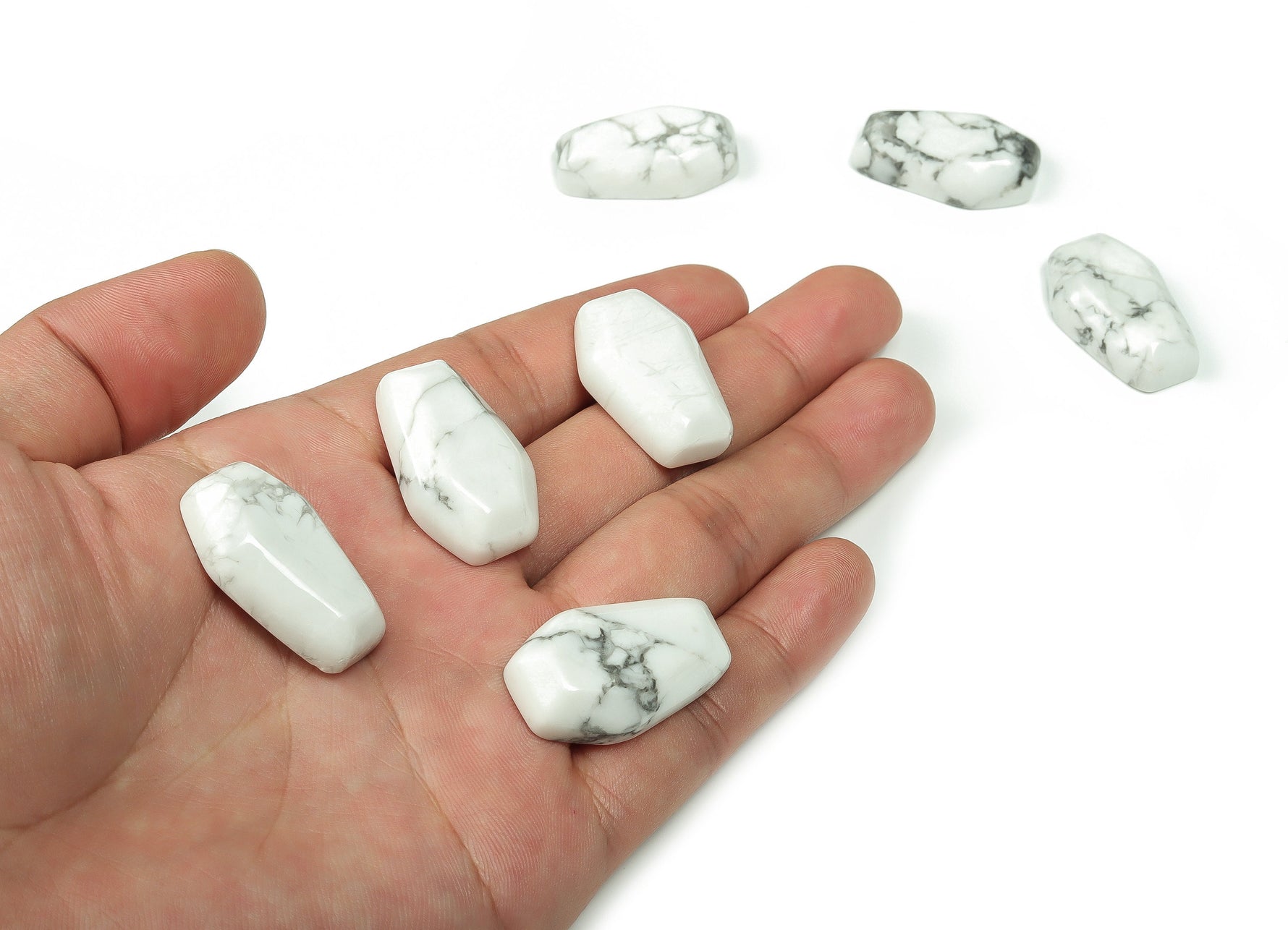 Howlite coffin-shaped crystal cabochon, 30mm gemstone carving by GemstoneGO showcasing smooth polished surface and natural white veining.