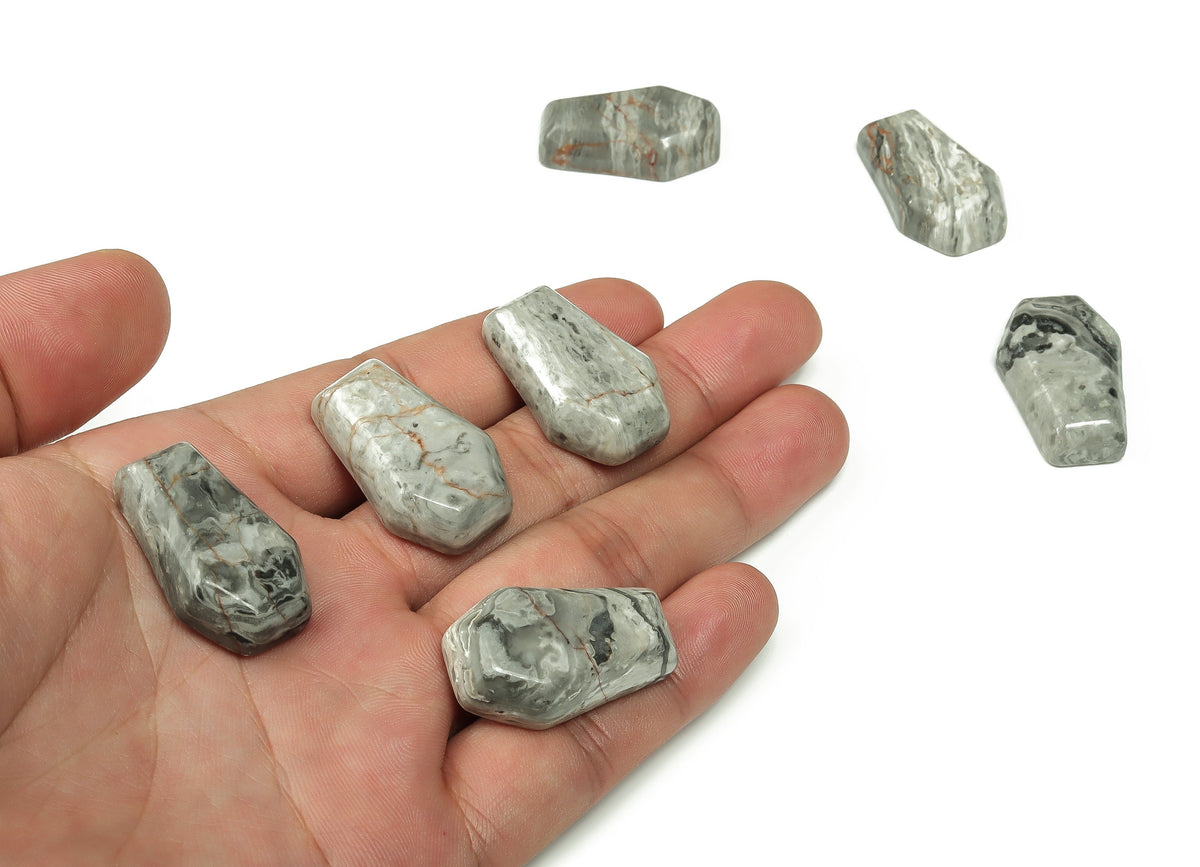 30mm Picasso Jasper coffin-shaped crystal cabochon with detailed carving from GemstoneGO, showcasing rich natural patterns.
