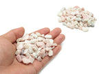Pink Opal crystal chips, semi-tumbled 7-12mm gemstones in bulk from GemstoneGO, shown in a close-up image.
