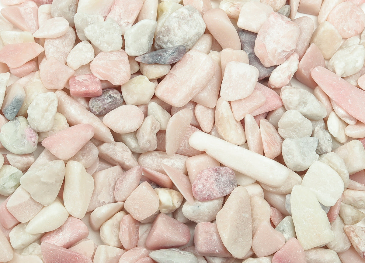 Pink Opal Crystal Chips from GemstoneGO, semi-tumbled 7-12mm stones, showcasing smooth, vibrant pink gemstone chips.