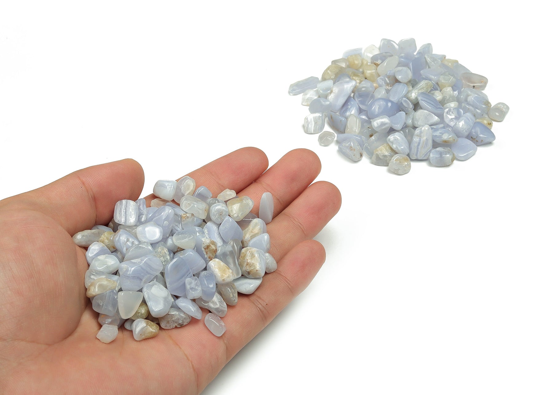 Blue Lace Agate crystal chips, semi-tumbled stones in 7-12mm, shown in bulk with vibrant blue and intricate lace patterns.