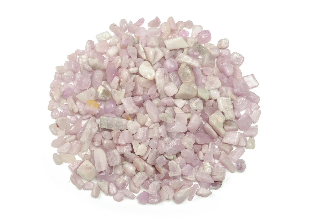Kunzite crystal chips in 7-12mm semi-tumbled stones, natural gemstone from GemstoneGO, shown in bulk with pinkish-purple hue.