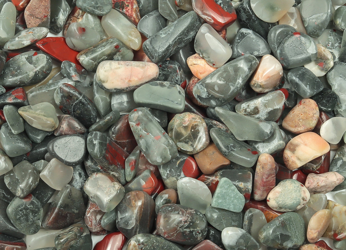 African Bloodstone crystal chips, semi-tumbled 7-12mm gemstones from GemstoneGO, displayed in a bulk pack.