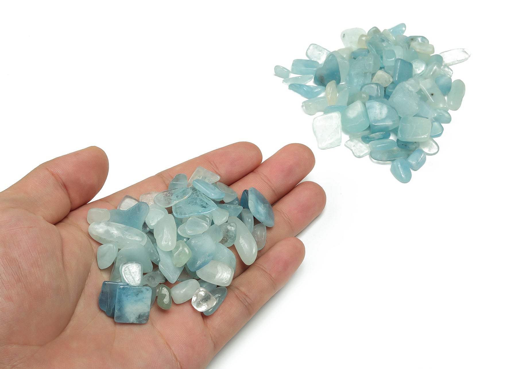 Semi-tumbled aquamarine crystal chips, 6-10mm gemstone stones from GemstoneGO, shown in a close-up image.