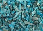Blue Apatite crystal chips in semi-tumbled 7-12mm size, natural gemstone from GemstoneGO, shown in a close-up image.