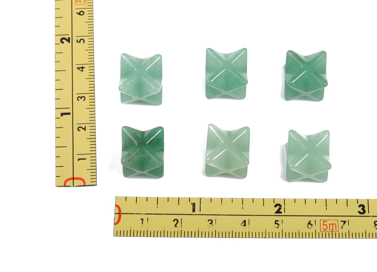 A 13mm Aventurine Merkaba star crystal from GemstoneGO, used for Reiki healing and spiritual meditation.