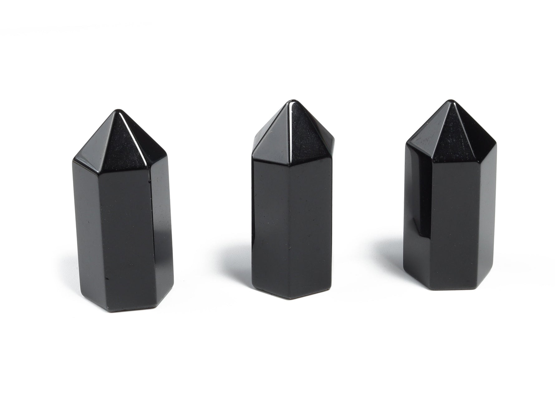 Dark obsidian obelisk tower crystal, 35mm gemstone sculpture with natural black stone features, by GemstoneGO.