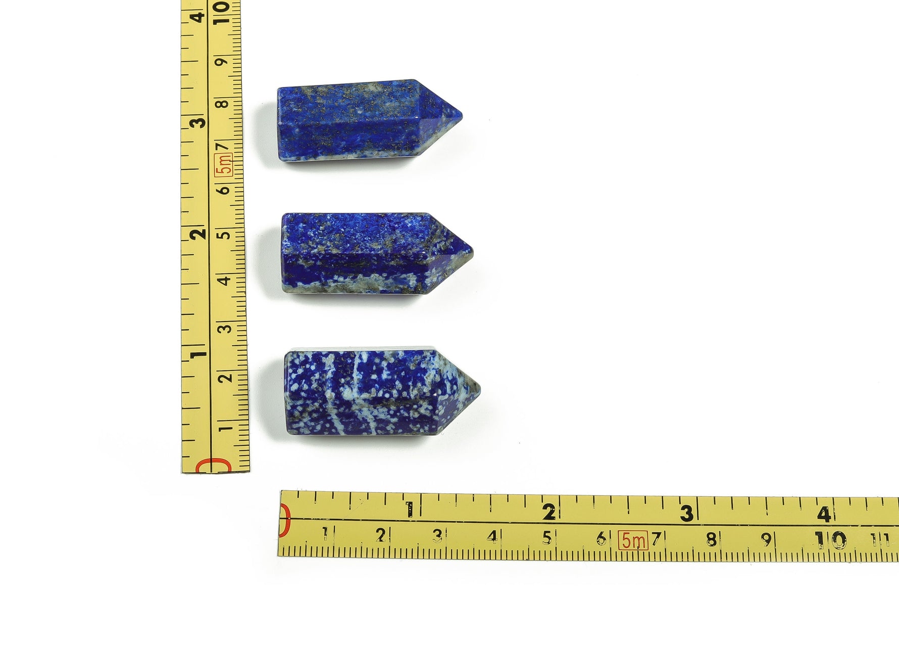 Lapis Lazuli obelisk tower crystal sculpture, 35mm, from GemstoneGO, showcasing deep blue stone with gold flecks and polished surface.