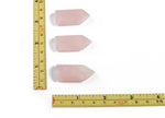 Rose Quartz obelisk tower crystal from GemstoneGO with a polished pink gemstone pointed shape on a neutral background.