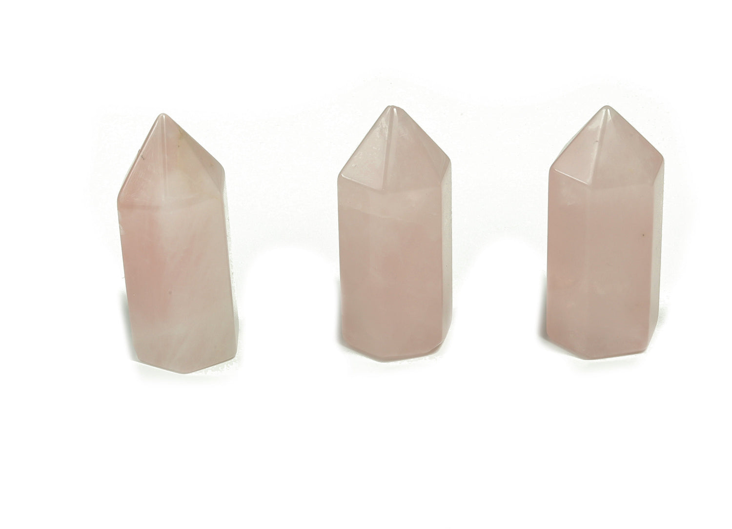 Rose Quartz obelisk tower crystal from GemstoneGO, showcasing a pink, polished gemstone with natural crystal formations.