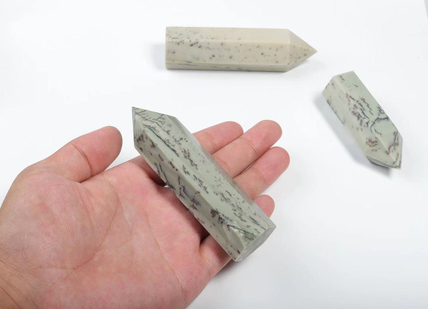 Dendritic Jade obelisk tower crystal featuring green and brown natural patterns, polished gemstone with a pointed top.